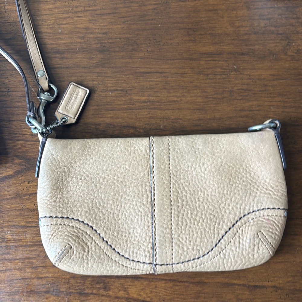 Coach wristlet. Tan color. Pebbled leather.